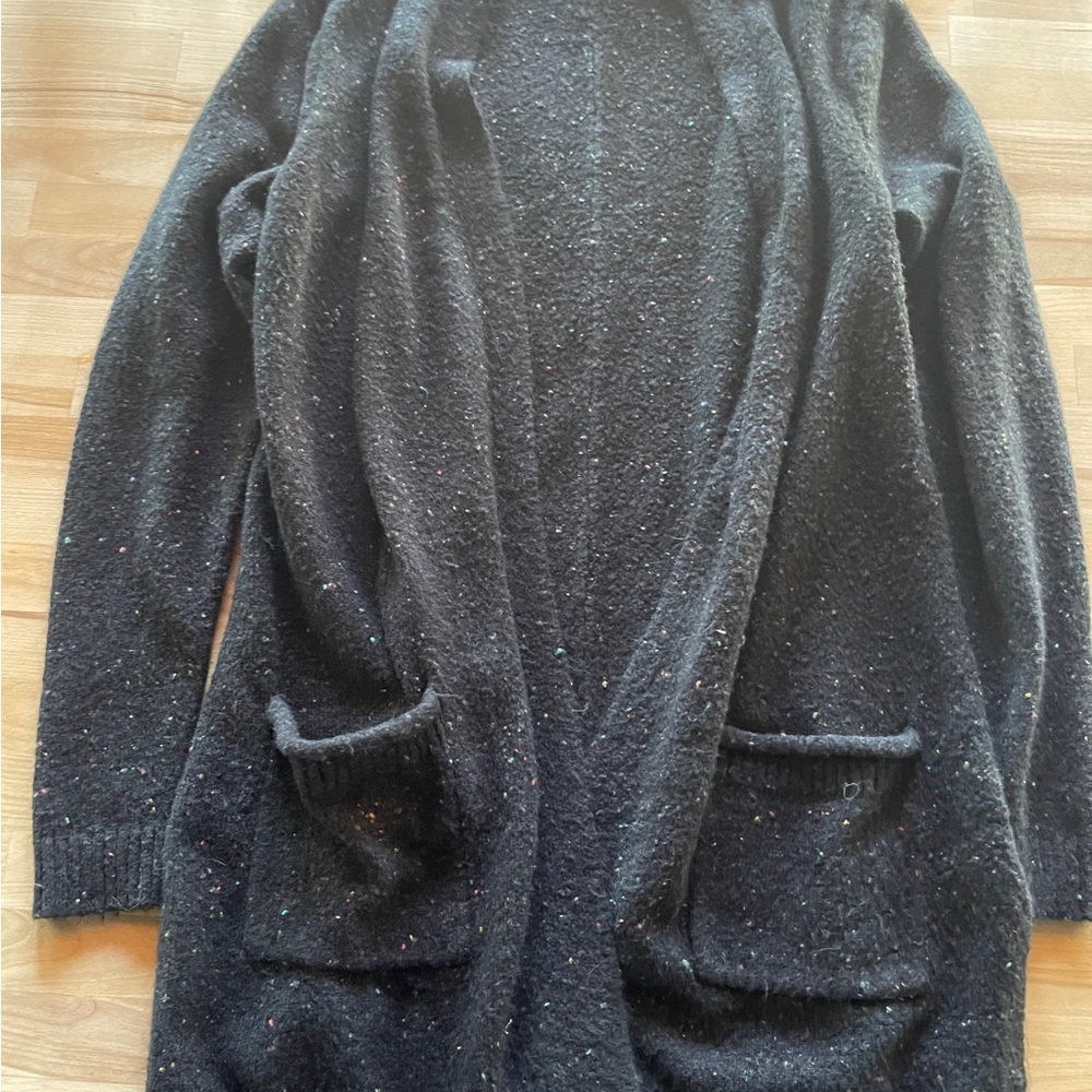Small woman’s cardigan. Worn maybe once!